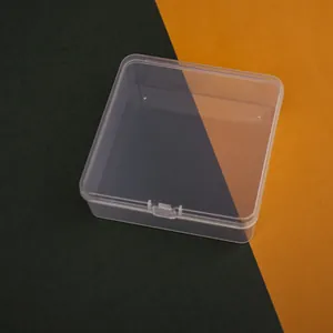 Top-down angled view of a 11.5cm square transparent plastic storage box for hardware