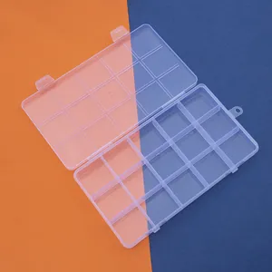 Detailed view of a 15-grid transparent plastic storage box with dual secure latches