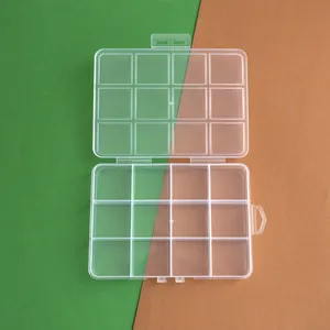 Macro detail view of a transparent 12-compartment PP plastic storage box for DIY beads