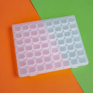 Detailed view of a 56-grid transparent plastic box for diamond painting and jewelry.