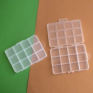 Close-up detail of a 12-grid transparent plastic storage box for bead organizing