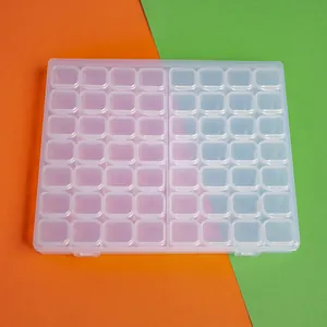 Close-up view of 56-grid clear plastic storage box for diamond painting and jewelry.