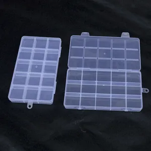 Detailed macro view of 15-grid clear plastic jewelry and craft tool storage boxes