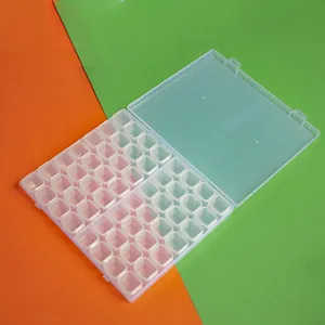 Close-up detail of 56-grid clear plastic storage box for diamond painting and beads