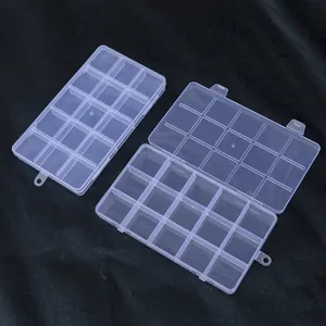 Top-down view of a clear 15-compartment plastic organizer box with fixed dividers.