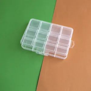 Detailed top view of a transparent 12-compartment plastic storage box for DIY bead organizing