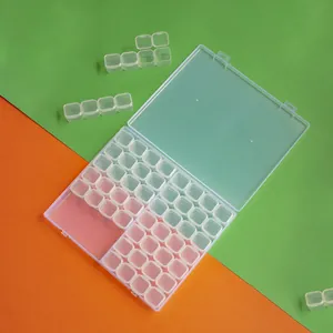 Close-up of 56-grid transparent plastic storage box with removable 4-slot compartments