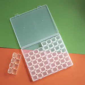 Macro view of 56-grid clear plastic organizer box showing removable storage compartments