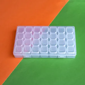 Caja de plástico transparente de 28 compartimentos para diamantes y accesorios de manicura