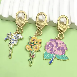 Close-up view of colorful enamel flower charms featuring heart-shaped gold-tone clasps