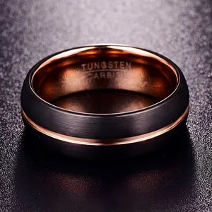 Detailed view of 8mm brushed black tungsten ring with rose gold groove and engraving