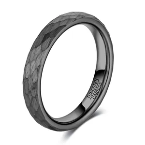 Detailed macro view showing the unique hammered texture on this black tungsten ring