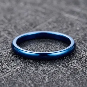 Macro detail of a 2mm blue tungsten steel ring with a polished mirror finish