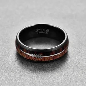 Close-up of 8mm black tungsten ring with wood inlay and silver arrow detail.