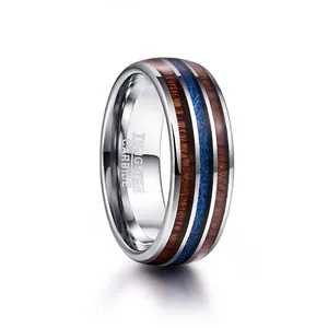 Detail of 8mm tungsten carbide ring with acacia wood and blue meteorite inlay pattern
