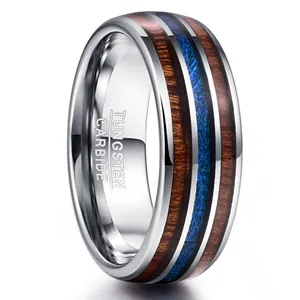 8mm wide dome tungsten carbide ring featuring acacia wood and blue faux meteorite inlay