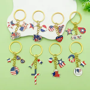 Collection of American Independence Day enamel keychains with patriotic charms and stars.