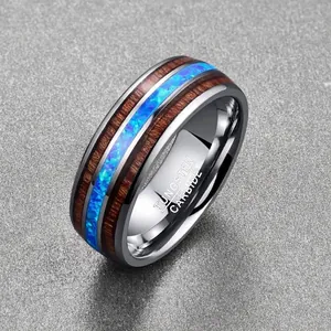 Macro view of 8mm tungsten ring with acacia wood and vibrant blue opal inlays