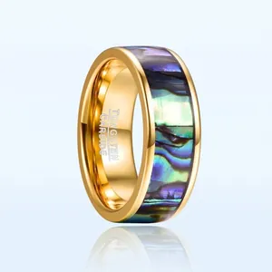 Close-up detail of 8mm gold plated tungsten carbide ring with abalone shell inlay