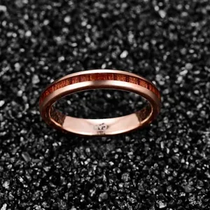 Detail of rose gold tungsten ring featuring a dark acacia wood inlay, 4mm width