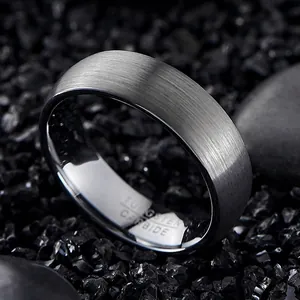 Detailed macro view of a 7mm wide brushed tungsten carbide ring with metallic texture