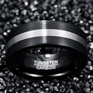 Close-up of 8mm black and silver brushed tungsten carbide ring with interior engraving