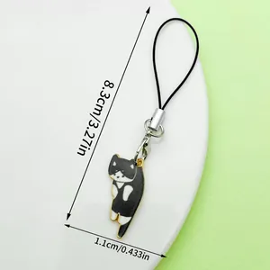 Close-up van schattige zwart-witte emaille katten-telefoonbedel met afmetingen