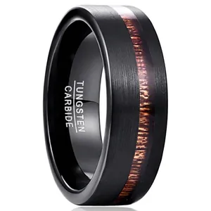 Detailed close-up view of 8mm black brushed tungsten ring featuring a natural acacia wood inlay