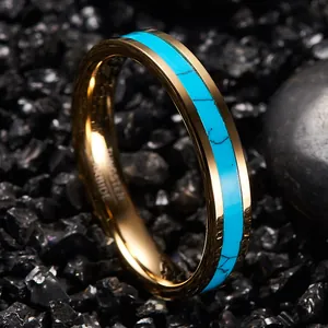 Macro detail of 4mm gold-plated tungsten carbide ring with turquoise inlay on black stones