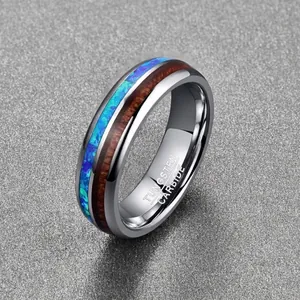 Close-up of 6mm polished tungsten ring featuring blue opal and acacia wood inlay