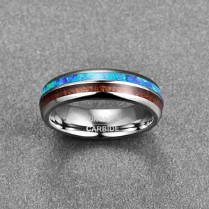 Detail of 6mm domed polished tungsten ring with blue opal and acacia wood inlay