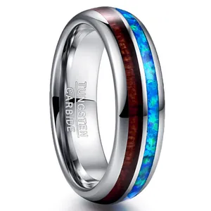 Professional 6mm polished tungsten carbide ring featuring koa wood and blue opal inlay