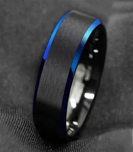Macro detail of men's black matte tungsten steel ring with vibrant blue beveled edges.