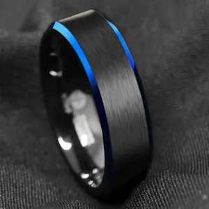 Close-up detail of 6mm black matte tungsten steel ring with blue beveled edges for men
