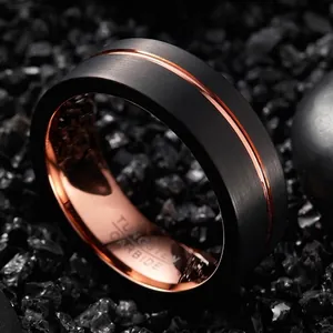 Close-up detail of 8mm black and rose gold two-tone tungsten carbide ring