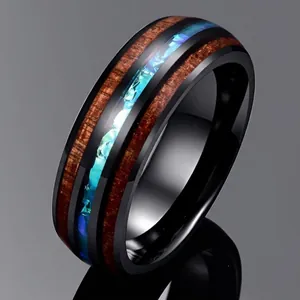 Detailed macro view of 8mm black polished tungsten ring with acacia wood and blue opal inlay