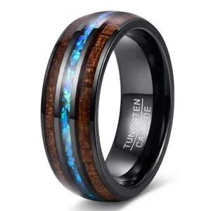Close-up macro detail of 8mm black tungsten ring featuring koa wood and iridescent opal inlay