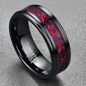 Detail view of black tungsten carbide ring with red dragon pattern and material engraving