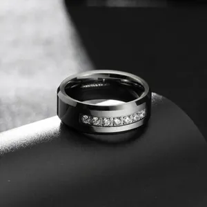 Macro detail of 8mm men's tungsten steel ring with inlaid sparkling zircons