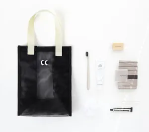 Detailed top-down view of black mesh beach bag with toiletry accessories