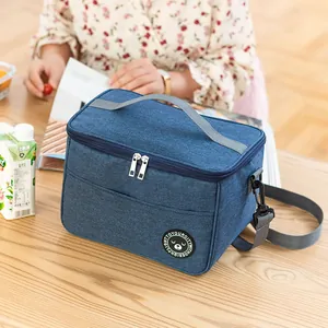 Large blue insulated lunch bag with an adjustable shoulder strap and top handle
