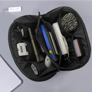 Spacious black digital accessory organizer bag showing internal storage for cables and gear