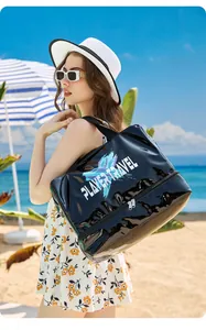 Outdoor model carrying a black glossy waterproof beach bag with wet and dry separation