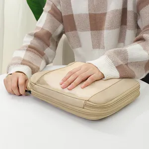 Beige travel luggage organizer bag with breathable mesh top for clothes storage