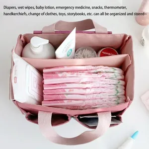 Roze kinderwagen organizer tas met meerdere vakken voor luiers en babybenodigdheden