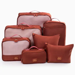 7-piece set of reddish-brown travel packing cubes for efficient luggage organization