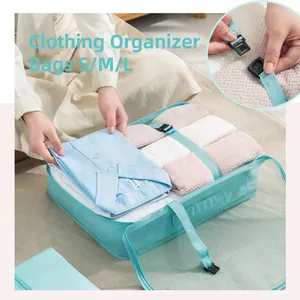 Teal mesh travel packing cube set with secure buckles for efficient suitcase organization