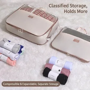 Set of two cream large capacity compression storage bags for clothes and bedding