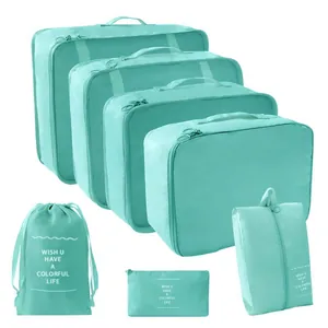Complete 7-piece mint green travel packing cubes set and storage bags for luggage