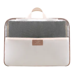 Large capacity beige foldable storage bag for clothes and quilts featuring mesh top